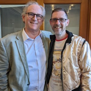 A photo of Peter Davison and Jason Brown